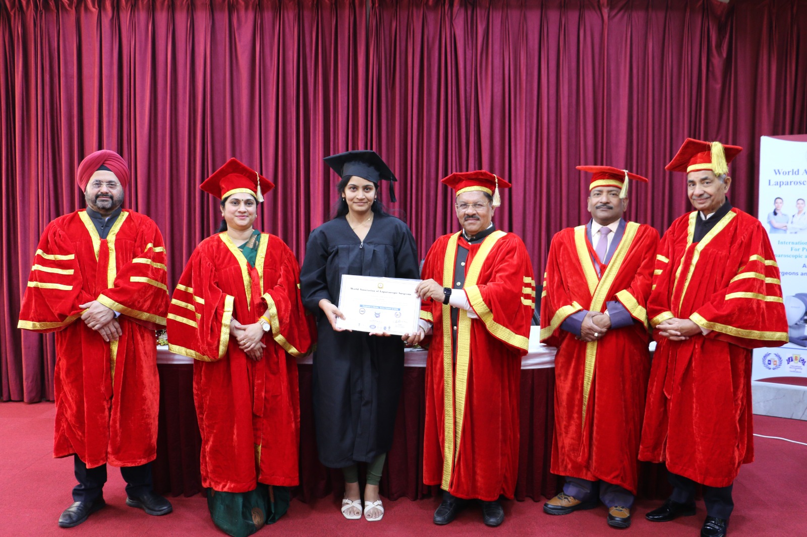 Dr. Sanhitha Purushotham receiving an academic recognition