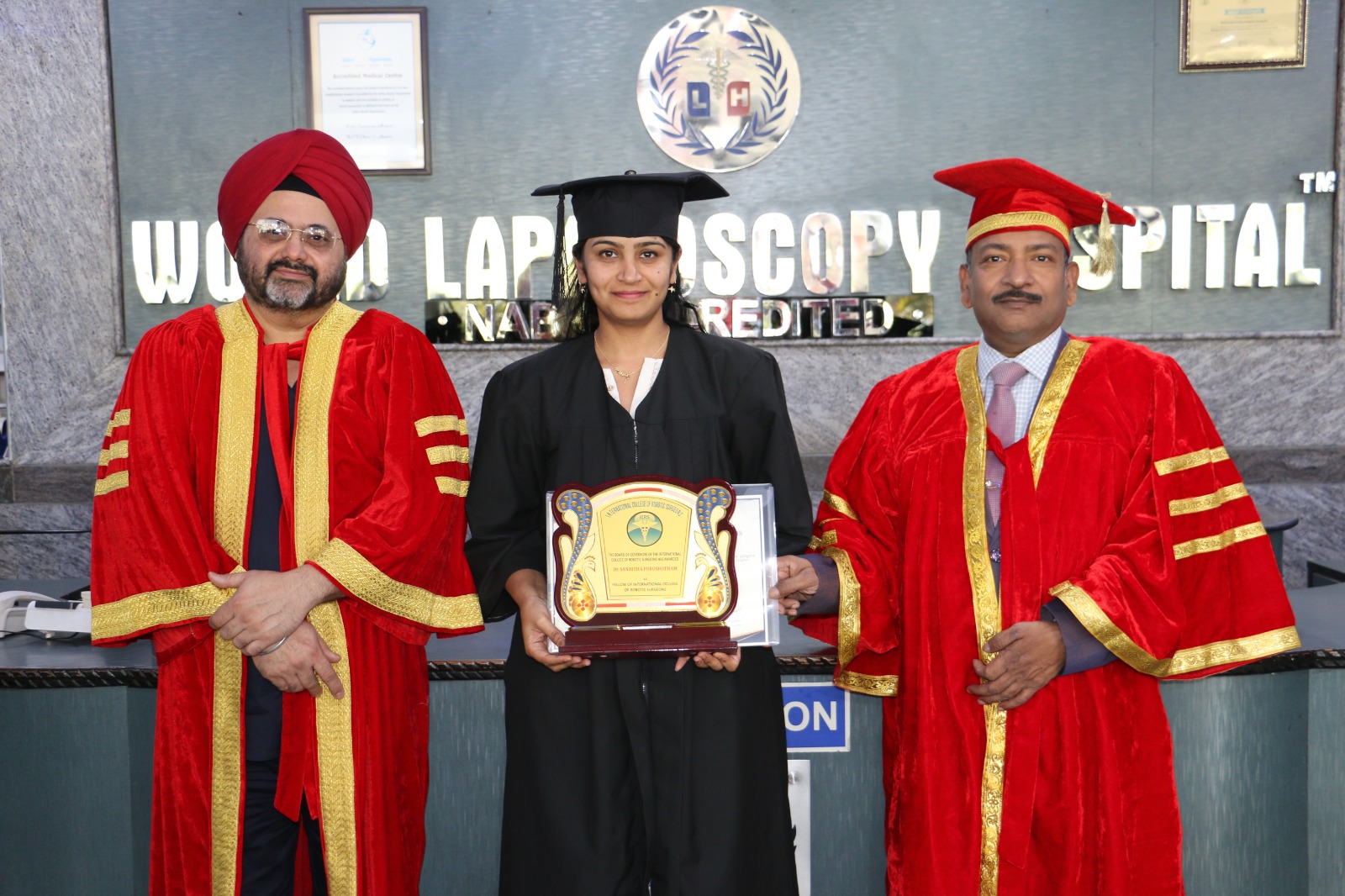 Dr. Sanhitha Purushotham receiving an award